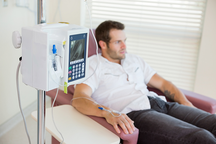 Cancer Treatment Center with man receiving chemotherapy 